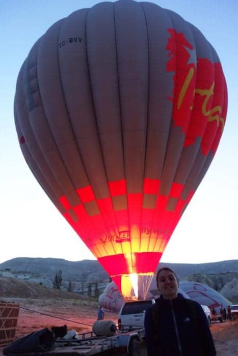 A hot air balloon firing up ready for launch in Cappadocia, Turkey. 