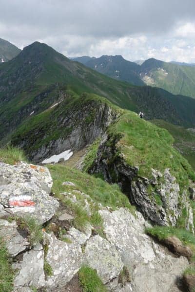 An amazing adventure through the Romanian countryside to hike above the Transfagarasan highway, Brasov, dracula, vlad the impaler, Transylvania, Carpathian mountains, Busteni, Cabana Babele, hiking, trails, where to hike, Romania, climbing, adventure, explore, holiday, backpacking, mountain, trail, alps, routes, via ferata, via ferrate, scrambling, cable car, price, time, how to get to Busteni, Buşteni, Valea Jepilor, Juniper Valley,Bucegi Mountains, Piatra Arsă,Transfagarasan, Ceaușescu, Romania, The best road in the world, top gear, lake Balea, Lezerul Caprei, 2418m / 7933ft, cycling event, go pro, horse and cart, gypsy, countryside, 