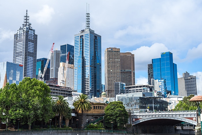 The tall buildings of the Melbourne skyline taken from one of the bridges on the Yarra River.