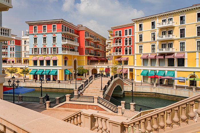 Colourful buildings in the venice inspired section of The Pearl known as Qanat Quartier in Doha, Qatar