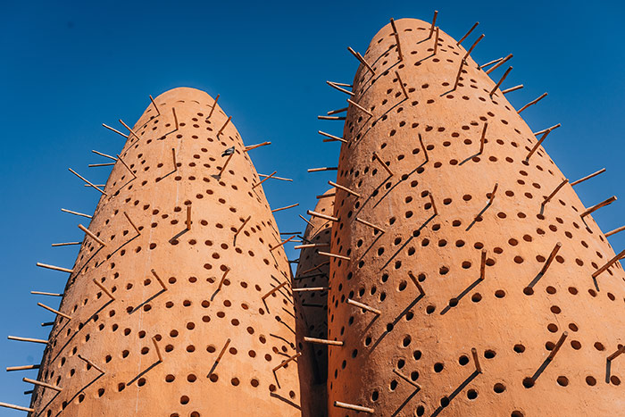 Two traditional mud packed Arabic pigeon towers at Katara in Doha, Qatar