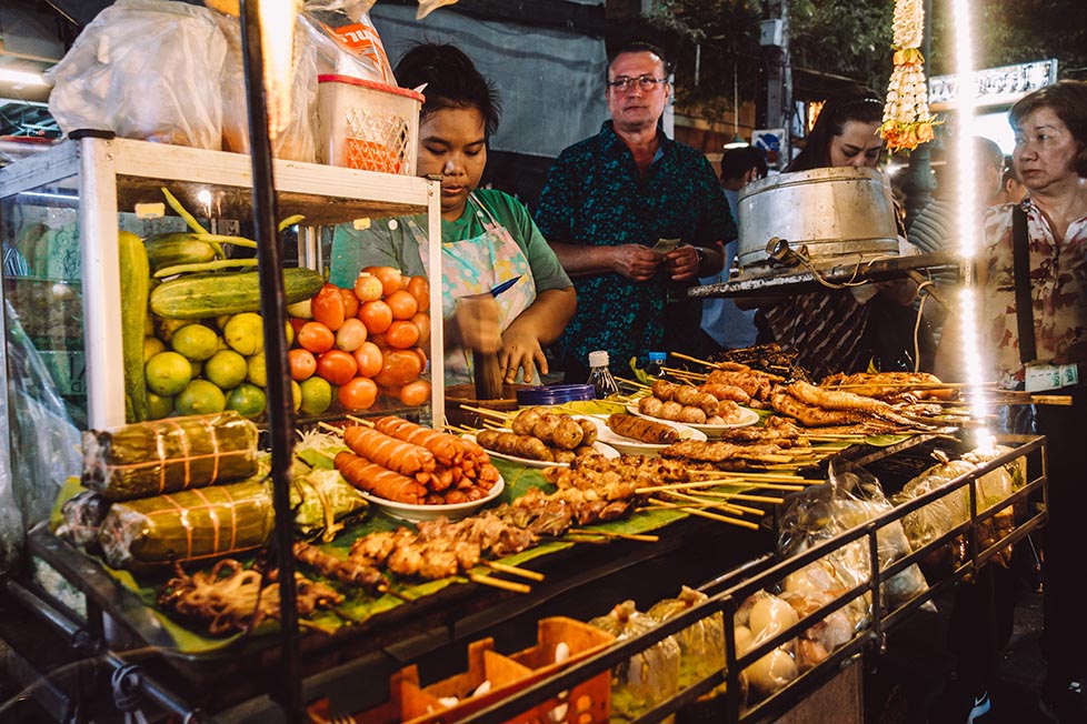 A woman is selling street food in Bangkok, Thailand