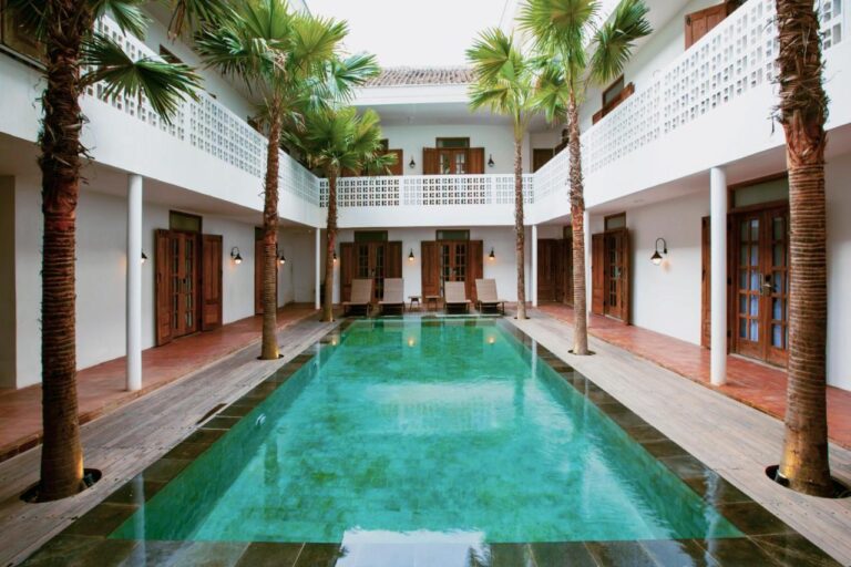 The swimming pool and courtyard of adhisthana hotel in yogyakarta, indonesia