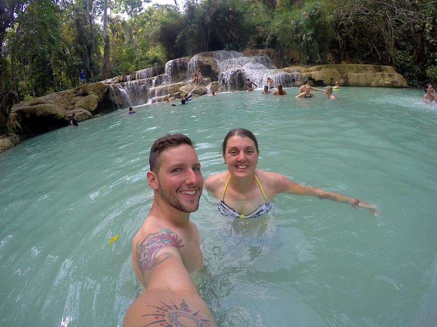 Nic and paul swimming in Kuang Si waterfall in Luang Prabang, Laos