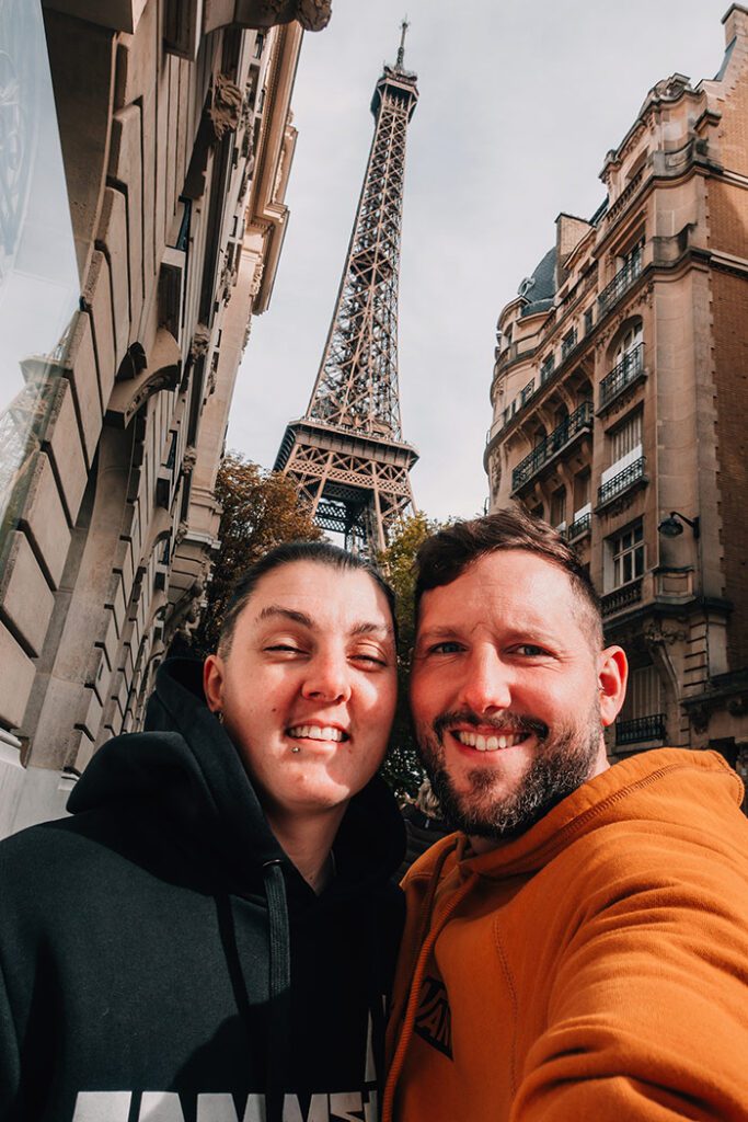 Nic and Shorty taking a selfie in Paris, France with the Eiffel Tower in the background. Best Romantic European City Breaks