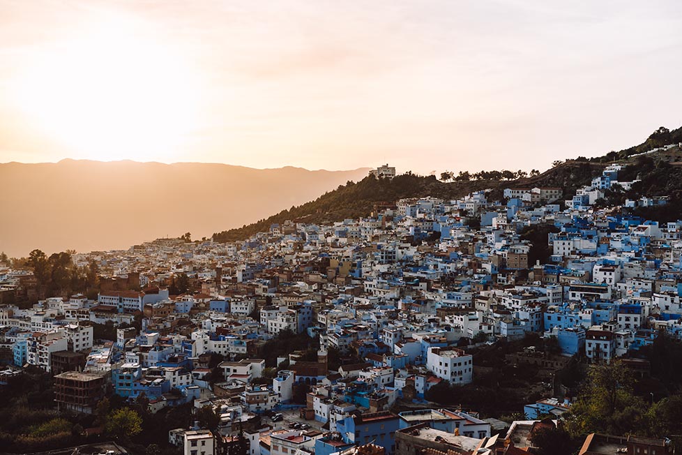 A golden sunset over the blue town of chefchaouen