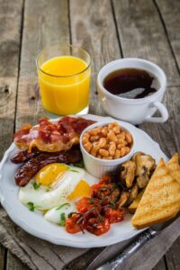full English breakfast with coffee and orange juice