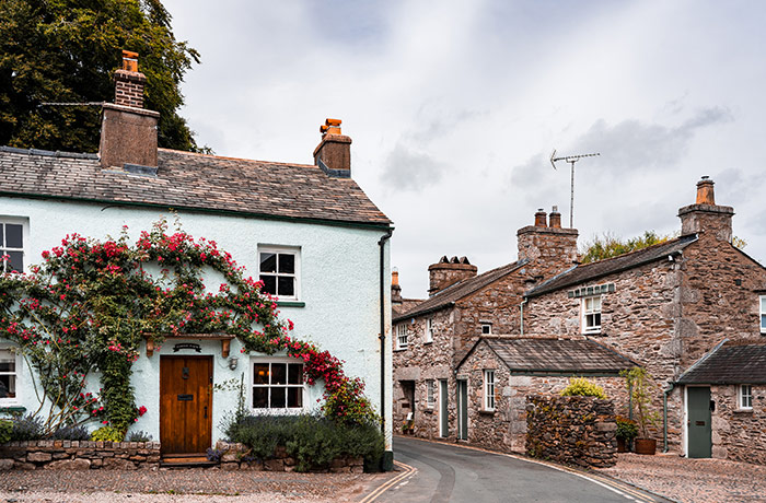 Lovely little stone cottages in a village, traditional English village, ivy on the walls