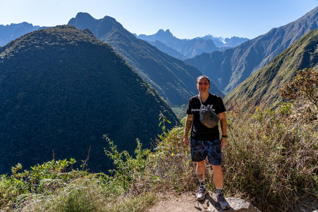 Nic standing on the Inca Trail after the steep hike from the train line with mountain behind them